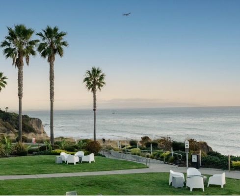 Kick back at an oceanside fire pit and soak in the view with a cocktail from Marisol in Pismo Beach, California.